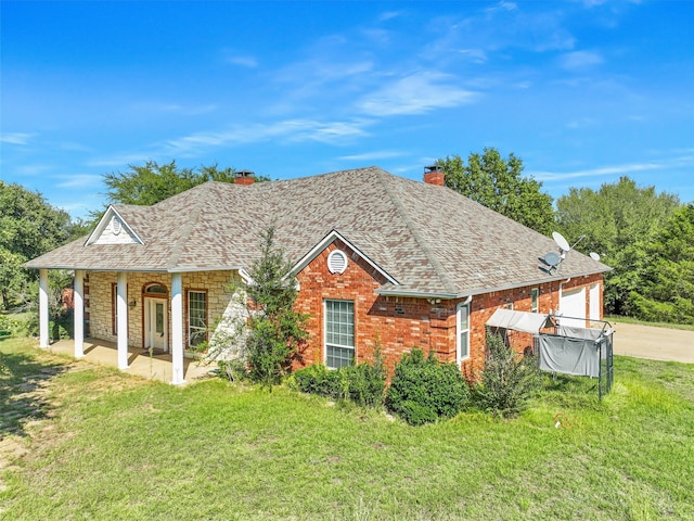 view of front of property featuring a garage and a front lawn