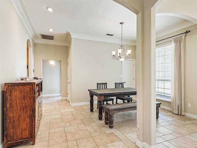 dining room featuring an inviting chandelier and crown molding