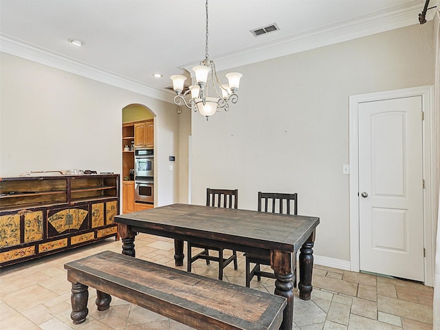 dining space with a notable chandelier and ornamental molding