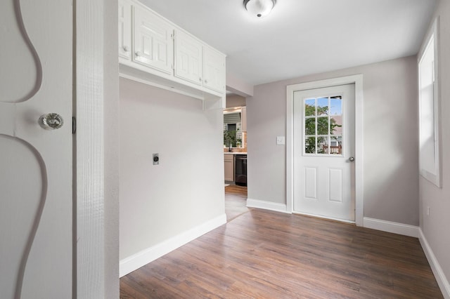 interior space featuring wood finished floors and baseboards