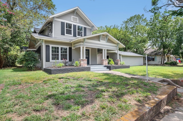 craftsman inspired home with a front lawn and covered porch