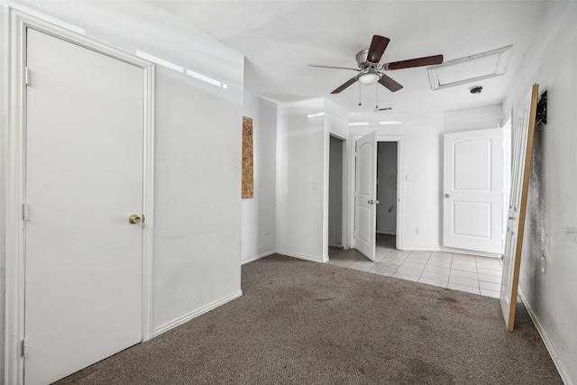 unfurnished bedroom with ceiling fan and light colored carpet