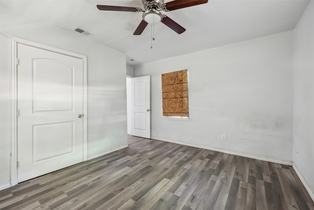 unfurnished bedroom with dark wood-type flooring and ceiling fan