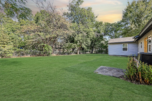 view of yard at dusk