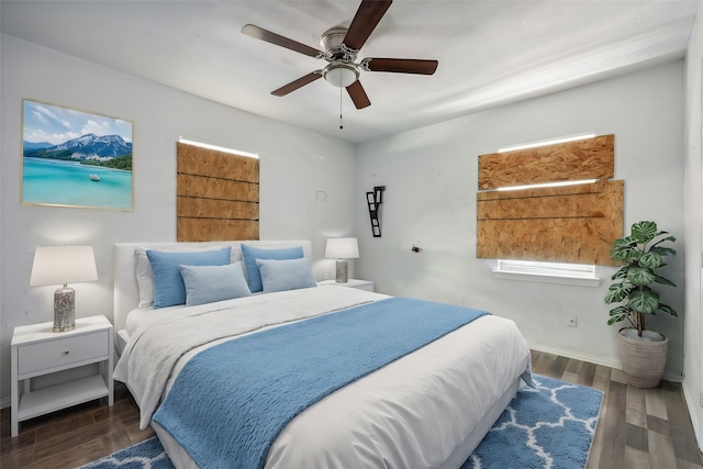 bedroom with dark wood-type flooring and ceiling fan