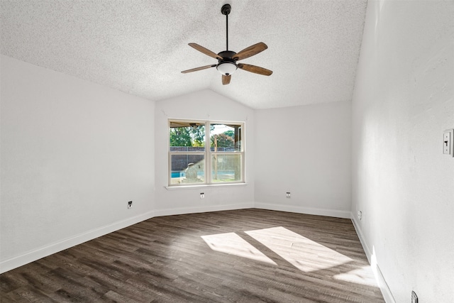 unfurnished room with lofted ceiling, ceiling fan, a textured ceiling, and dark hardwood / wood-style flooring