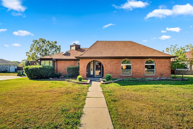 ranch-style home with a front lawn