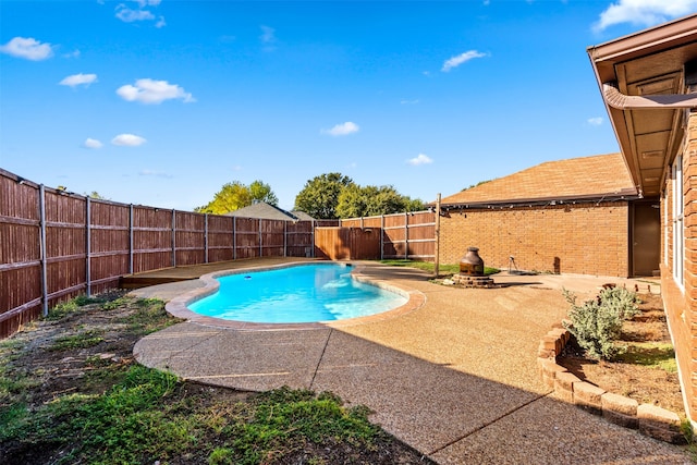 view of swimming pool with a patio area