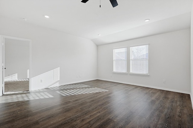 spare room featuring lofted ceiling, ceiling fan, and dark hardwood / wood-style flooring