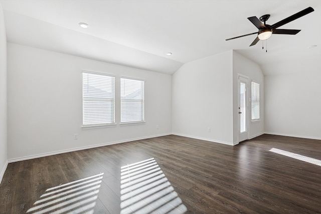 unfurnished living room featuring dark wood-type flooring, ceiling fan, and lofted ceiling