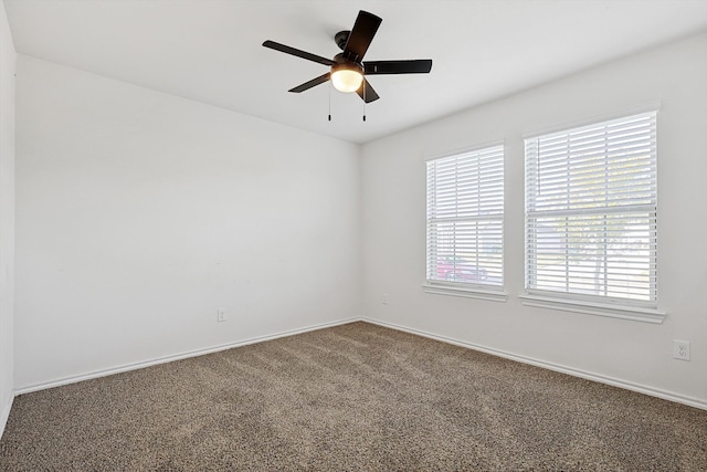 spare room with carpet flooring and ceiling fan