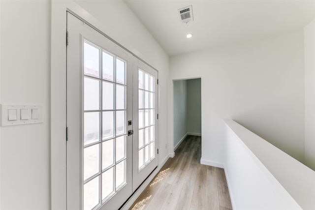 doorway with light wood-type flooring