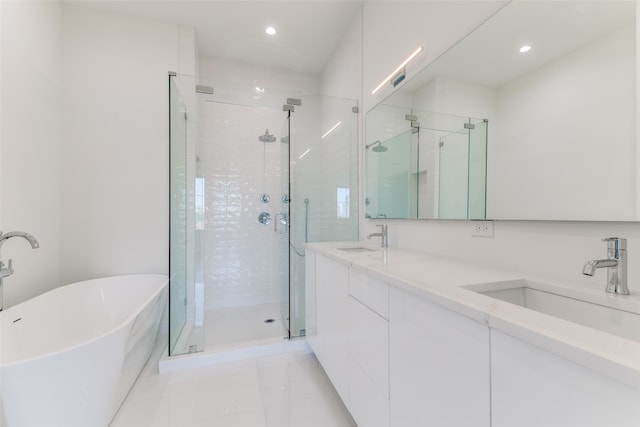 bathroom featuring vanity and separate shower and tub