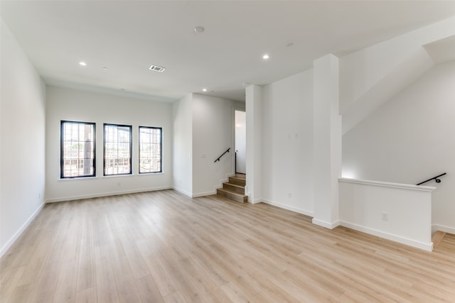 unfurnished living room with light wood-type flooring