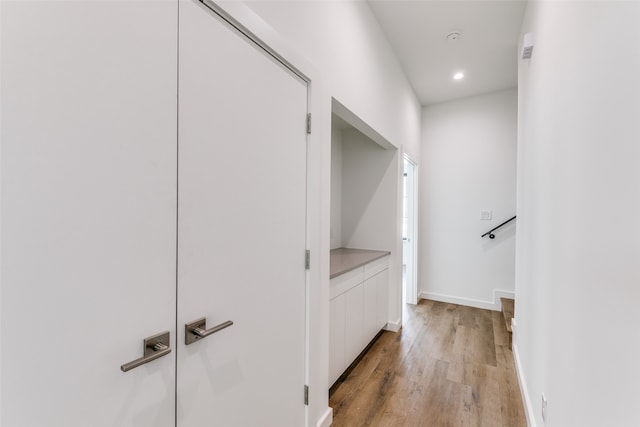 hall with light hardwood / wood-style floors