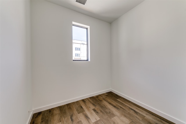 empty room featuring hardwood / wood-style flooring