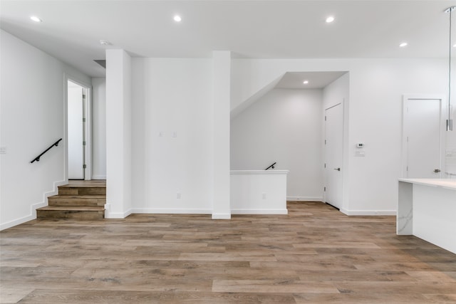 unfurnished living room with light hardwood / wood-style flooring