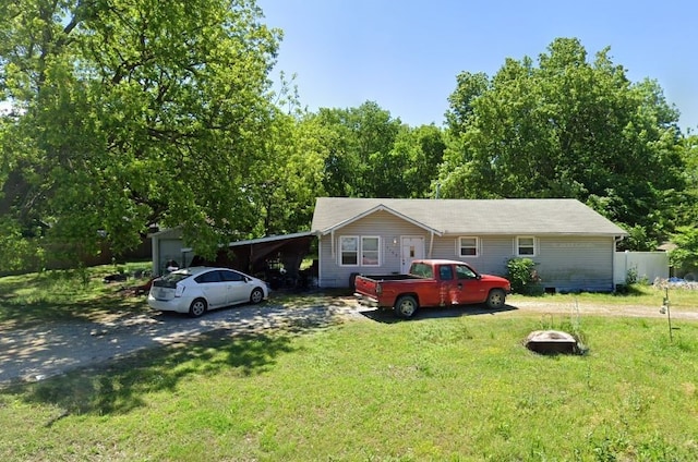 single story home featuring a front lawn