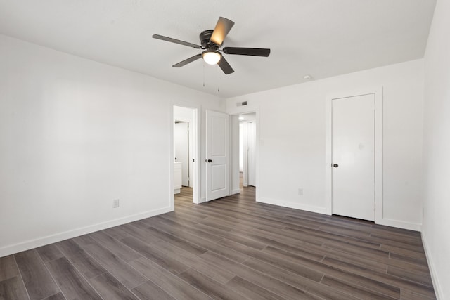 unfurnished bedroom featuring ceiling fan, a closet, and dark hardwood / wood-style flooring