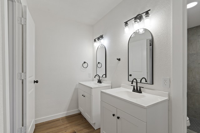 bathroom with vanity and hardwood / wood-style floors