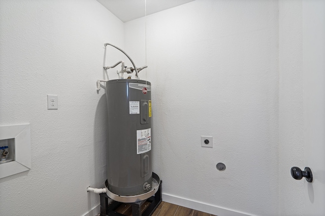 utility room with electric water heater