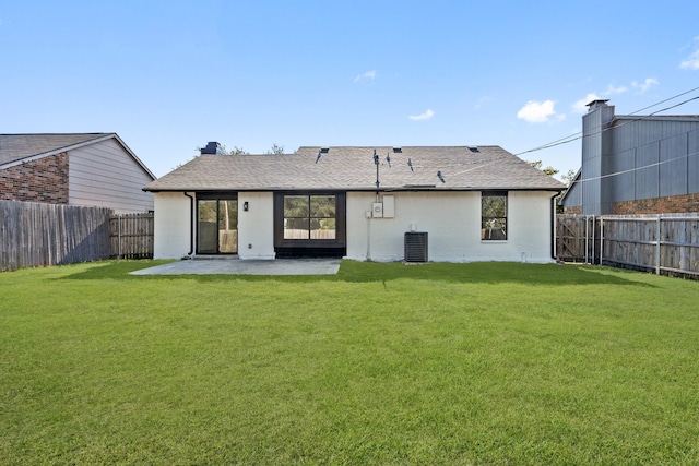 back of house with a patio, central AC, and a lawn