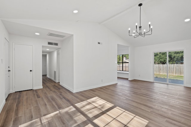 interior space featuring hardwood / wood-style floors, beam ceiling, a chandelier, and high vaulted ceiling