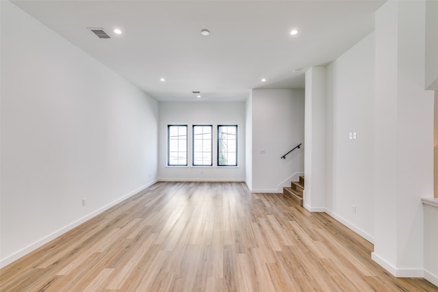 spare room featuring light hardwood / wood-style flooring