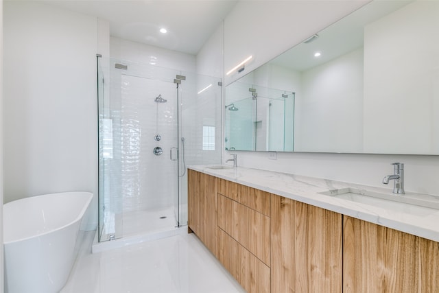 bathroom with vanity, shower with separate bathtub, and tile patterned flooring