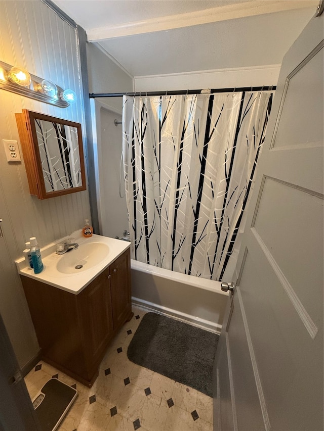 bathroom featuring vanity and shower / bathtub combination with curtain