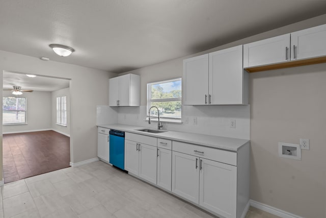 kitchen featuring white cabinetry, ceiling fan, sink, and stainless steel dishwasher