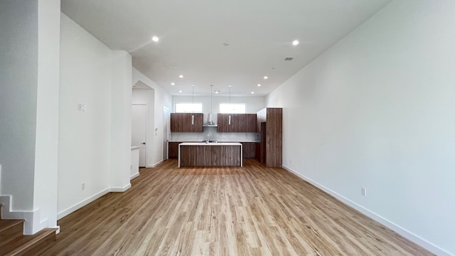 unfurnished living room with light wood-type flooring