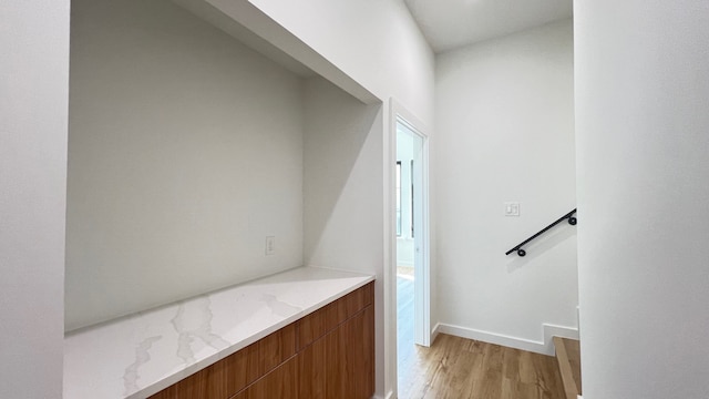 hall with light wood-type flooring