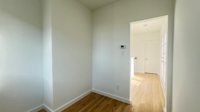 unfurnished room with hardwood / wood-style flooring