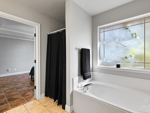 bathroom with baseboards, a bath, and a shower with curtain
