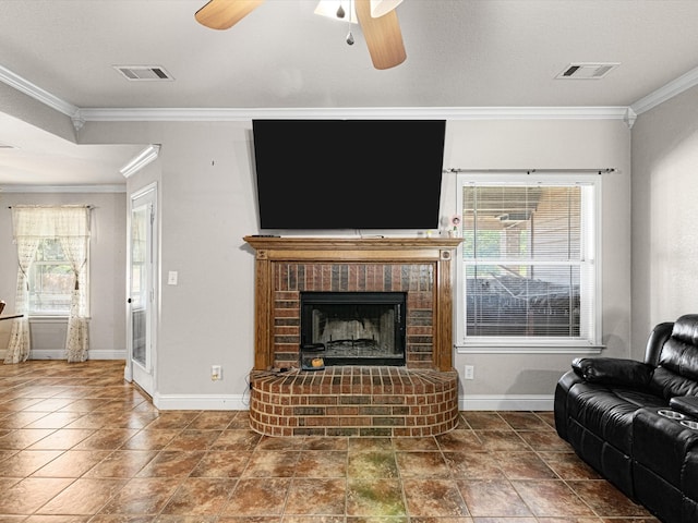 living room with ornamental molding, a fireplace, and ceiling fan