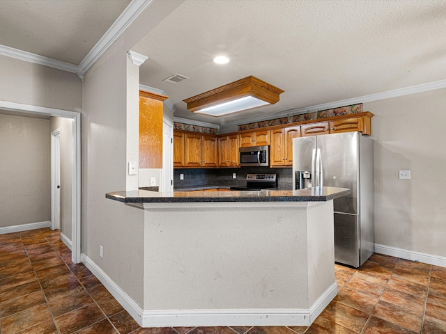 kitchen with a textured ceiling, kitchen peninsula, stainless steel appliances, crown molding, and decorative backsplash