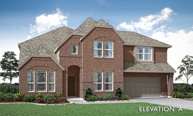 view of front of property with a garage and a front lawn