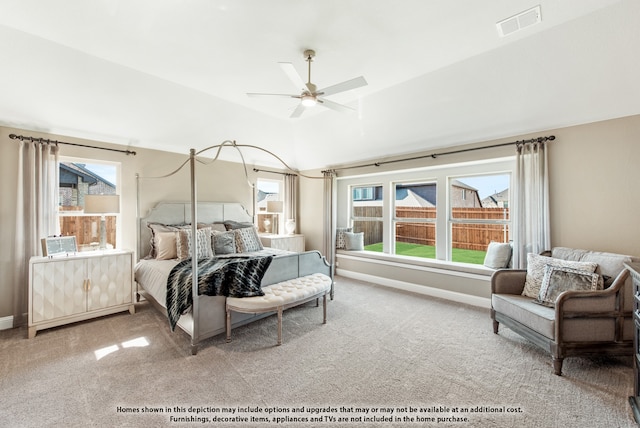 bedroom featuring lofted ceiling, light colored carpet, and ceiling fan