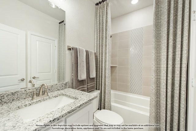 full bathroom featuring vanity, toilet, and shower / bathtub combination with curtain