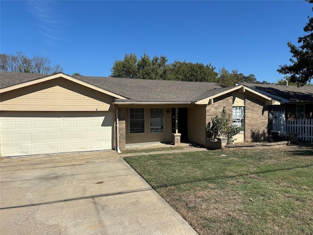 503 S Kaufman St, Seagoville, TX 75159 - ranch-style home featuring an attached garage, brick siding, concrete driveway, a front lawn, and a shingled roof