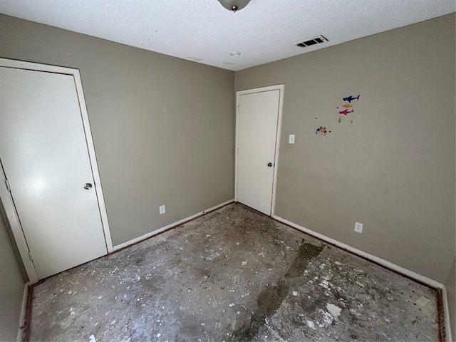 unfurnished bedroom featuring a textured ceiling