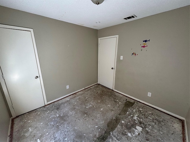 503 S Kaufman St, Seagoville, TX 75159 - unfurnished bedroom featuring baseboards and a textured ceiling