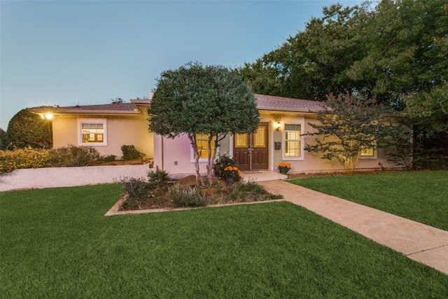 mediterranean / spanish-style house featuring a yard