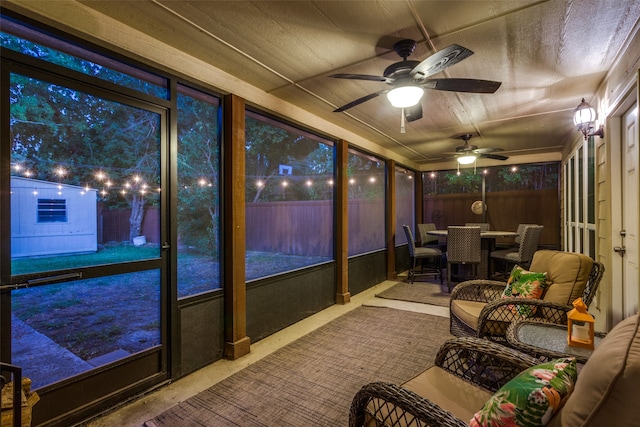 sunroom featuring ceiling fan