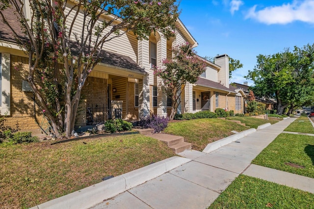 view of front of home with a front lawn