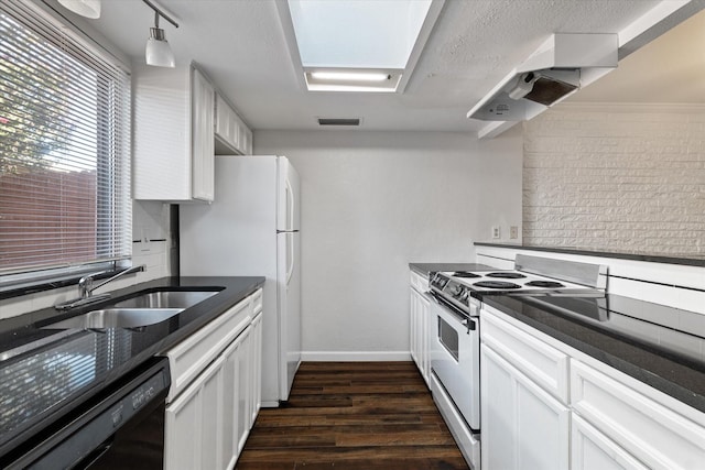 kitchen featuring white cabinets, range, and black dishwasher