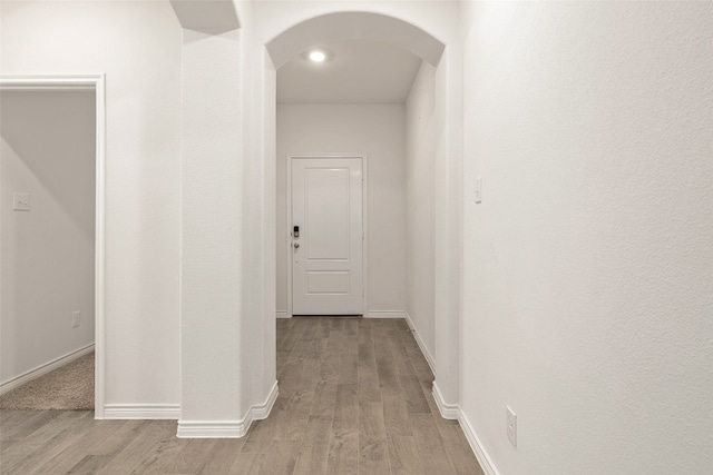 hall with light hardwood / wood-style flooring