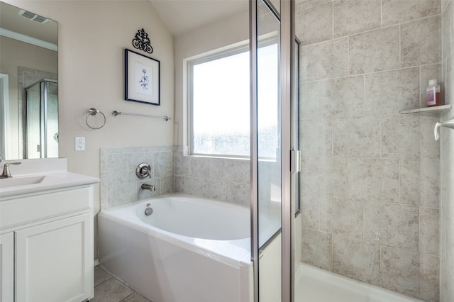 bathroom with vanity, plus walk in shower, lofted ceiling, and tile patterned floors