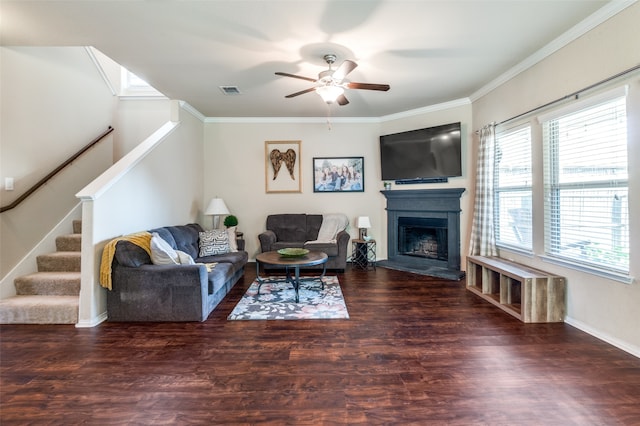 living room featuring crown molding, dark hardwood / wood-style floors, and ceiling fan